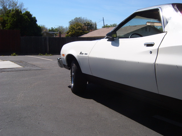 White 1973 Ford Ranchero parked outside, showing the side and front quarter panel