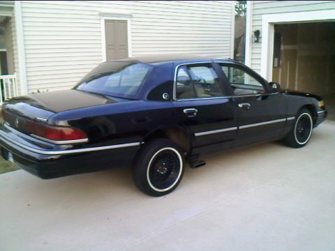 1993 Mercury Grand Marquis - This 1993 Mercury Grand Marquis is seen from a three-quarter front view, custom white-wall tires.