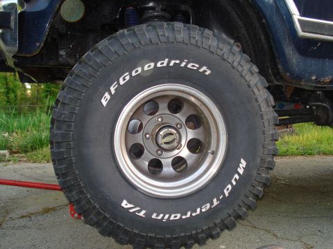 1984 Ford Bronco - Close-up of a BFGoodrich Mud-Terrain T/A tire mounted on a vehicle's wheel.