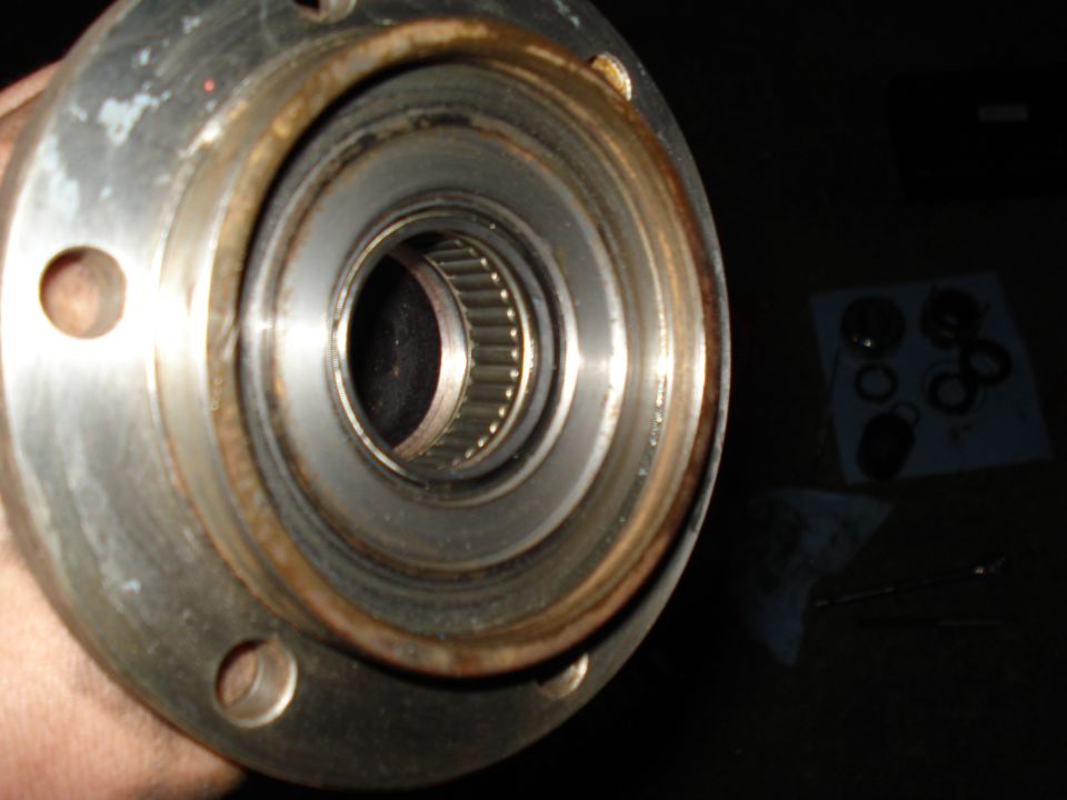 Close-up of a vehicle's wheel bearing and hub assembly, showing the inner workings of the bearing