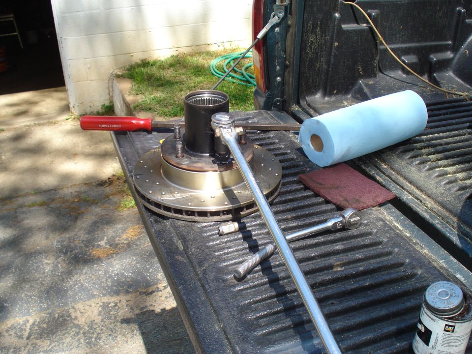 Brake rotor and hub assembly with a socket wrench on a truck bed