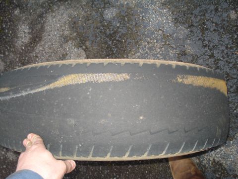 1994 Ford F-350 - Close-up of a worn tire, showing tread and sidewall details.