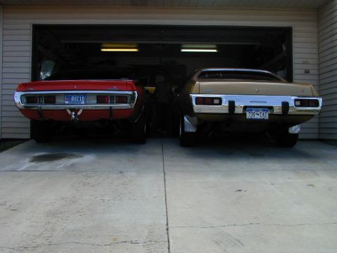 1979 Ford Bronco - Two Mopar muscle cars, a Dodge Charger and a Plymouth Road Runner, are parked in a garage.