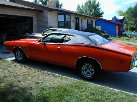 1979 Ford Bronco - This 1974 Dodge Charger SE features a distinctive orange paint job with a black stripe and vinyl roof.