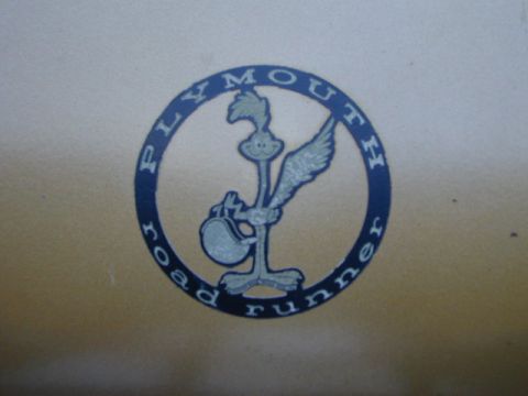 1979 Ford Bronco - Close-up of the iconic Plymouth Road Runner emblem, the cartoon bird and the model name.