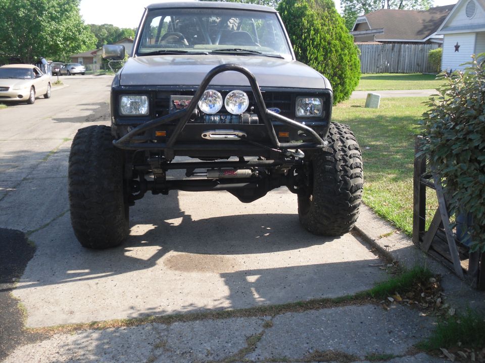 1984 Ford Bronco II with large off-road tires and custom front bumper with winch and lights