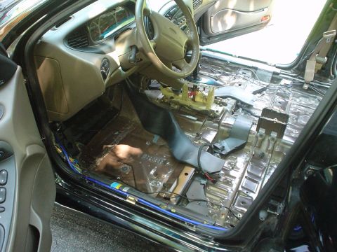 1999 Ford Taurus - Picture of the car gutted from the outside of the drivers door looking in.