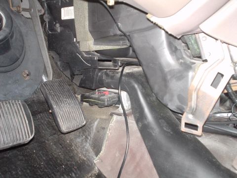 1999 Ford Taurus - Picture of the air ducting and gas pedal from the drivers foot well looking twards the front of the car.