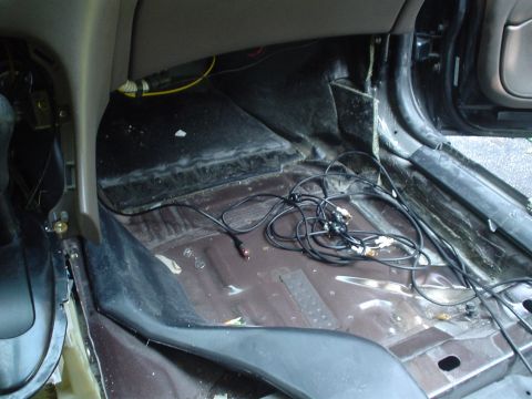 1999 Ford Taurus - Picture of the passengers footwell from the dead center of the car looking forward. The cables there are the rca's for my future radio mod.