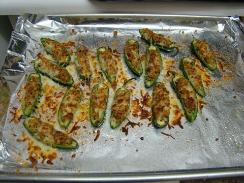 1989 Ford Bronco - Jalapeno poppers, stuffed and baked with cheese, sit on a foil-lined baking sheet.