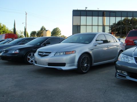 2003 Acura TL - Silver sedan parked in a lot with other vehicles. The car appears to be a 2004 model year.