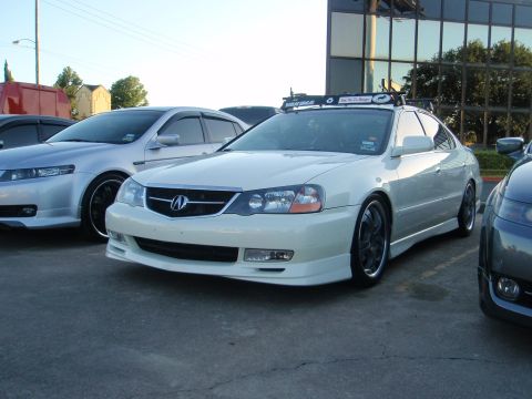 2003 Acura TL - White 2003 Acura TL sedan with roof rack and aftermarket wheels.