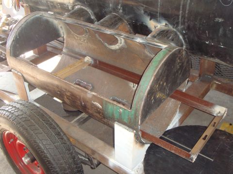 1992 Ford Bronco - A shop-built barbecue smoker under fabrication on a small utility trailer frame, with a cut-open steel drum barrel showing fresh weld beads…