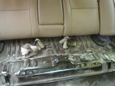 1999 Ford Taurus - This is a picture of the rear seat shelf from the center of the car looking bacwards.