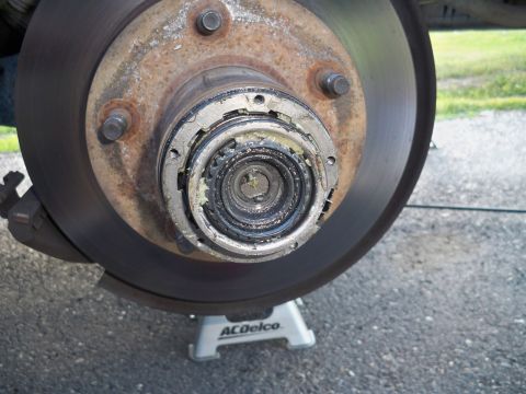 1994 Ford Bronco - Loosen the Torx screws and pull the top of the hub off.