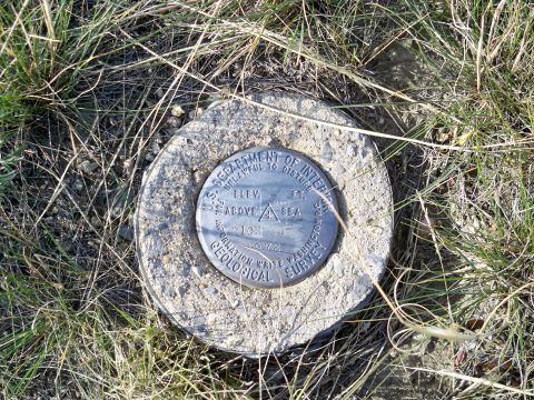 1994 Ford Bronco - Geological Survey marker shows elevation and survey information, dated 1972.