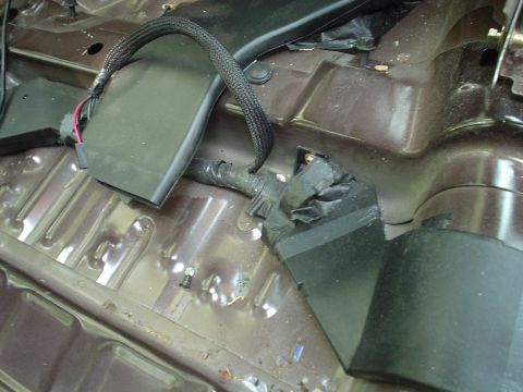 1999 Ford Taurus - This is a picture of the driver side rear floor vent and power seat connections taken from the center of the car looking forward.