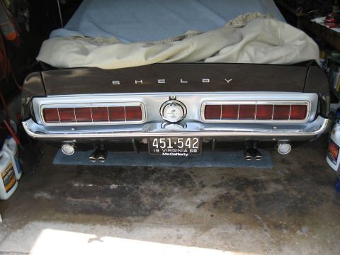 1968 Shelby GT500 - Rear view of a 1968 Shelby GT500, showing its distinctive taillights and quad exhaust pipes.