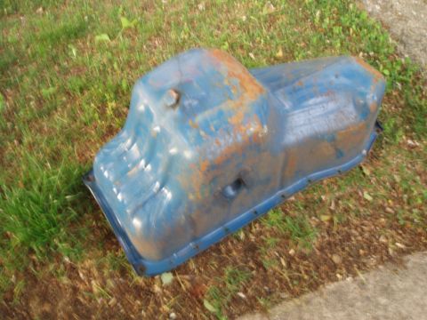 1979 Ford Bronco - This is a used oil pan, likely for an older vehicle, shown outdoors.