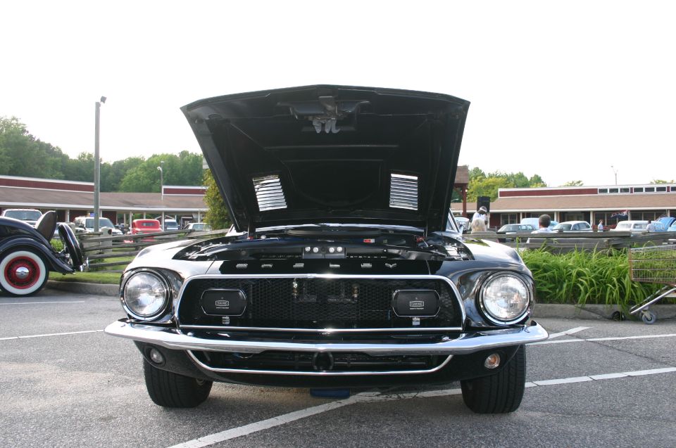 1968 Shelby GT500 front view, hood open, black paint, parked in lot