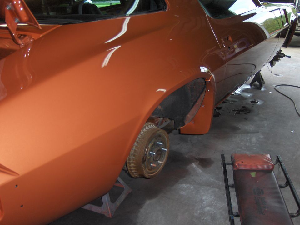 Orange 1980 Chevrolet Camaro rear quarter panel and wheel well