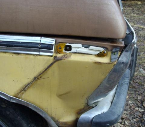 1976 Ford F-150 - Front fender and headlight assembly show damage and a broken turn signal lens.