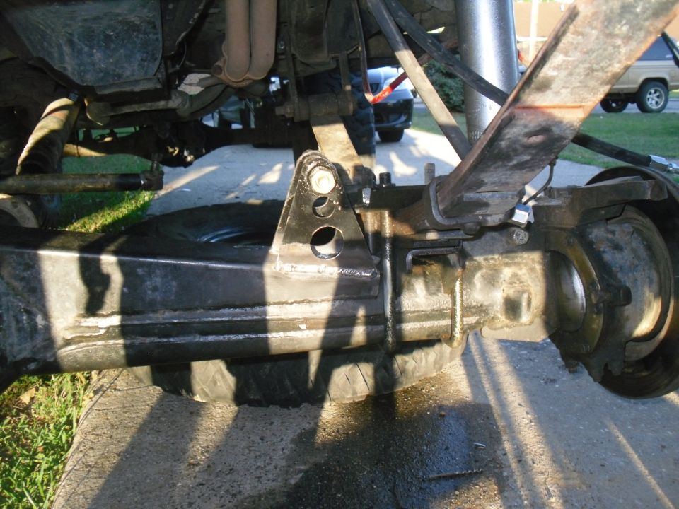 Rear axle and leaf spring assembly of a 1984 Ford Bronco II, showing suspension modifications
