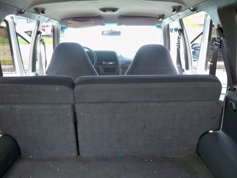 1994 Ford Explorer - Rear view of the interior of a 1994 Ford Explorer, showing the cargo area and front seats.