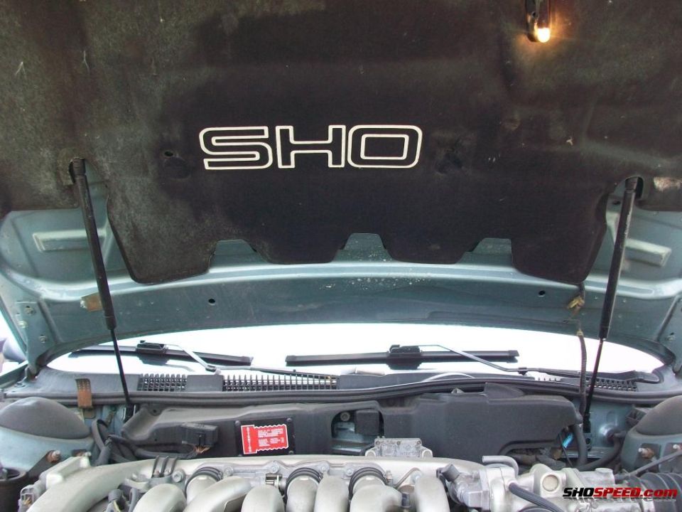 1993 Ford Taurus SHO engine bay with SHO emblem on hood liner