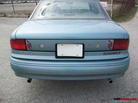 1993 Ford Taurus - Rear view of a light blue Mercury Sable sedan, indicating it is not a 1993 Ford Taurus.