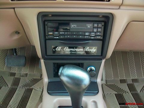 1993 Ford Taurus - Interior view of a car's center console, showing the gear shifter and radio unit.