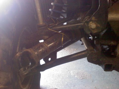 1996 Ford Bronco - Undercarriage view showing driveshaft and suspension components.