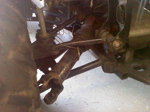 1996 Ford Bronco - This image shows the underside of a vehicle, focusing on the suspension and drive axle assembly.