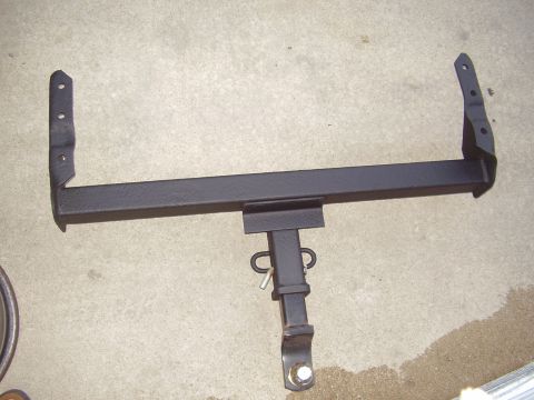 1996 Ford F-150 - A black trailer hitch is shown on a concrete surface. The hitch has a receiver and mounting brackets.