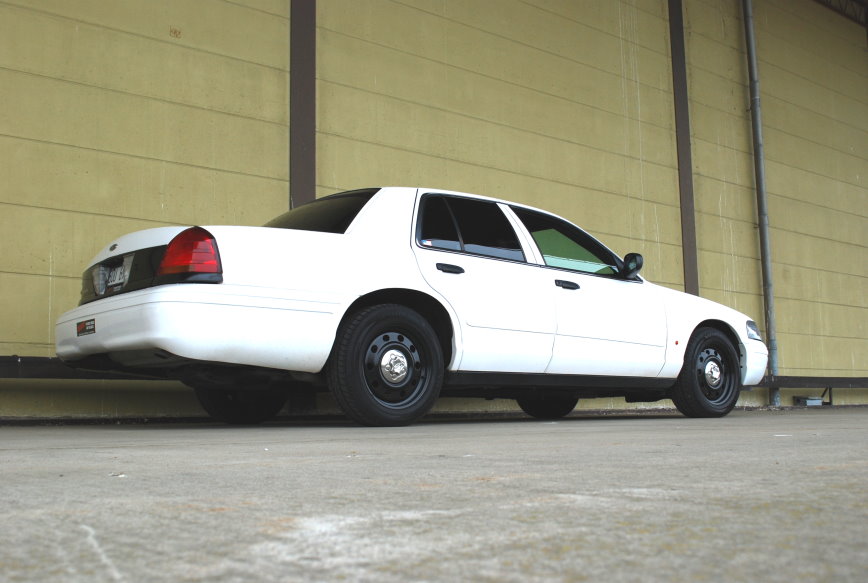 White 1998 Ford Crown Victoria, rear 3/4 view
