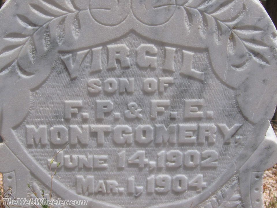 Gravestone with text for Virgil, son of F.P. & F.E. Montgomery, born June 14, 1902, died Mar. 1, 1904