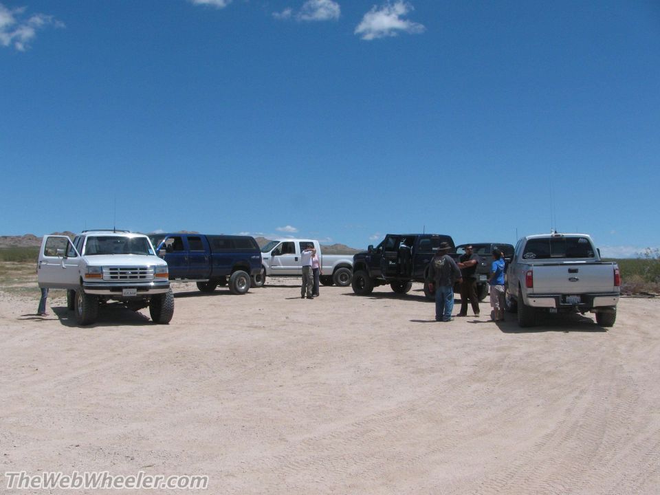 1996 Ford C-350 (Centurion Conversions) front view, white lifted truck with open door