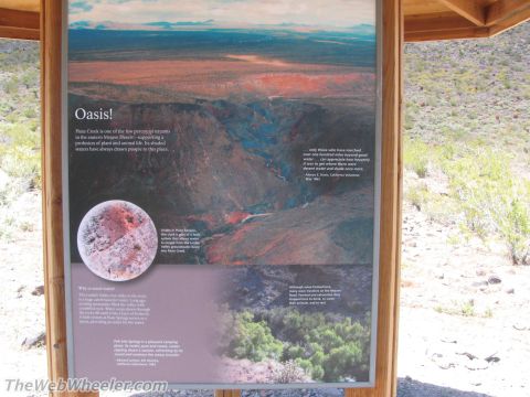1996 Ford C-350 (Centurion Conversions) - An interpretive sign describes the desert oasis, its water sources, and historical significance.