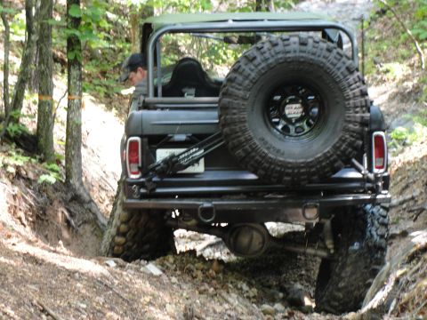 1967 Ford Mustang - This vehicle is navigating a narrow, wooded trail with steep inclines.