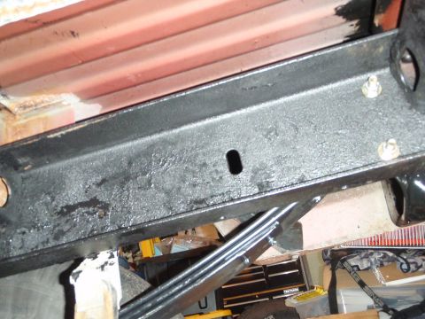 1995 Ford Bronco - Underside view of a vehicle's frame and suspension components, showing a leaf spring.