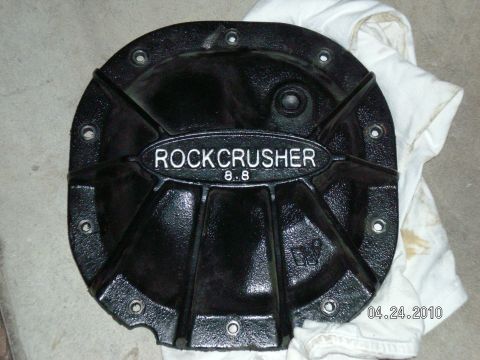 1996 Ford Bronco - A black differential cover labeled "ROCKCRUSHER 8.8" is shown on a white cloth.