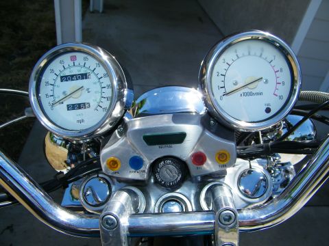 1992 Yamaha Virago - Close-up of a motorcycle's dashboard, showing the speedometer, tachometer, and indicator lights.