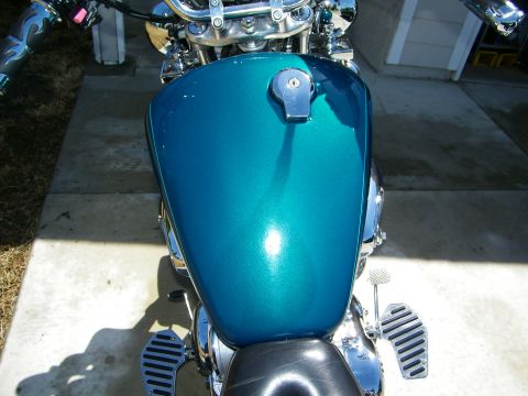 1992 Yamaha Virago - Top view of a teal motorcycle's gas tank and handlebars.