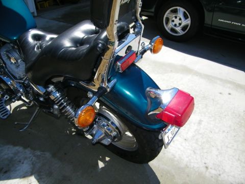 1992 Yamaha Virago - Rear section of a motorcycle, showing the seat, fender, and tail light assembly.