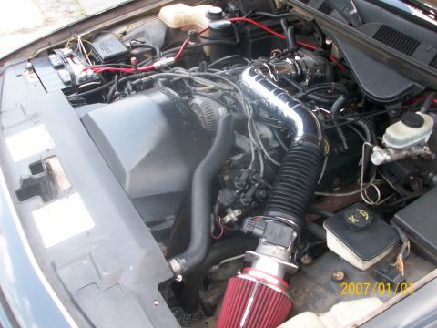 1993 Mercury Grand Marquis - The engine bay shows an aftermarket air intake system with a chrome tube and red filter. The date stamp indicates 2007.