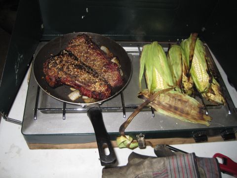 1989 Toyota Pickup/SR5 - Steak and corn being cooked on a portable camping stove.