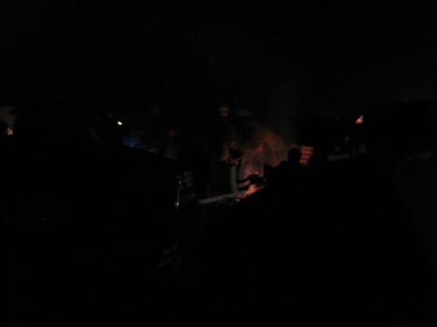 1989 Toyota Pickup/SR5 - A nighttime scene shows multiple vehicles gathered around a campfire, with the Supermotors logo visible at the bottom right.