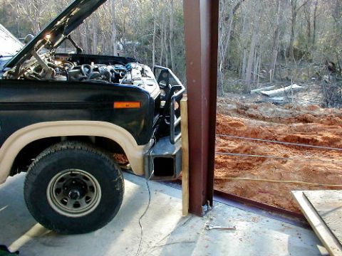 1983 Ford Bronco - I put a 10-ton snatch block on the forklift and ran the cable back to my bumper, parked against a column of the building, and ran a chain f…