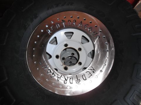 1991 Ford Bronco - A custom beadlock wheel with 'RED DRAGONS' engraved on the metal ring.