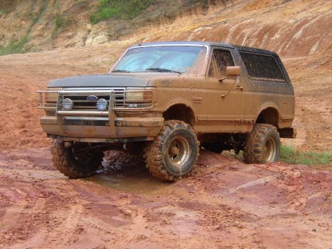 1991 Ford Bronco - This 1991 Ford Bronco is shown navigating a muddy off-road course.